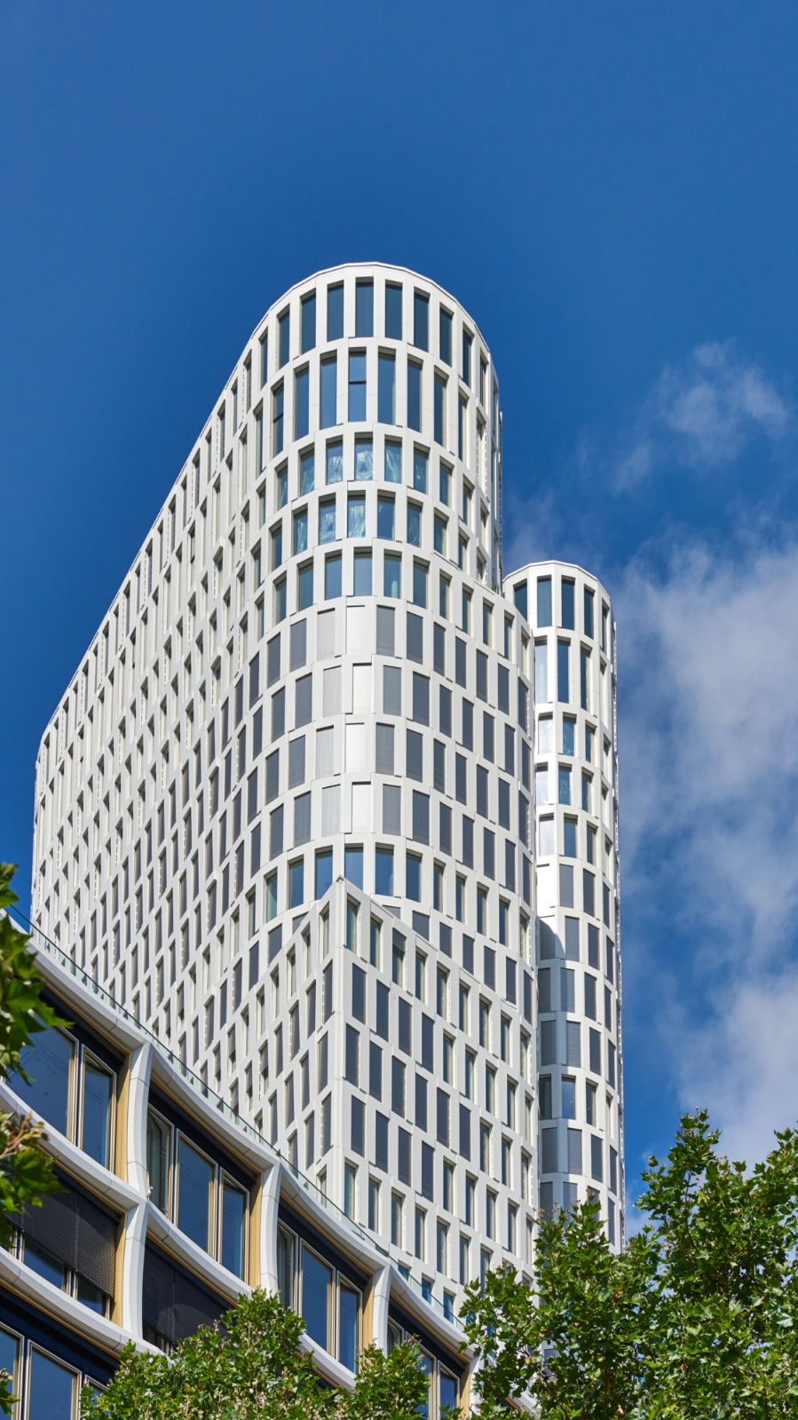 Curved limestone façade against blue sky